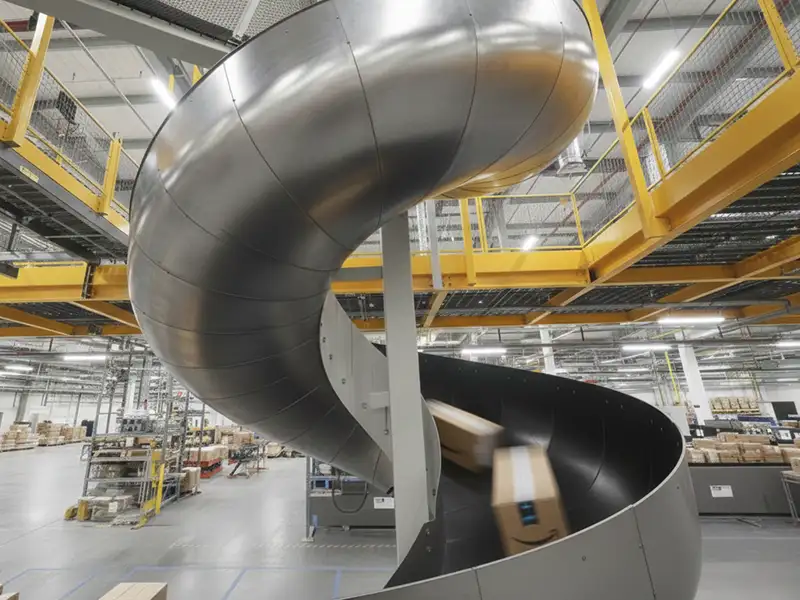 Black polyethylene chute liners (Poly Chute) lining an Amazon package slide.